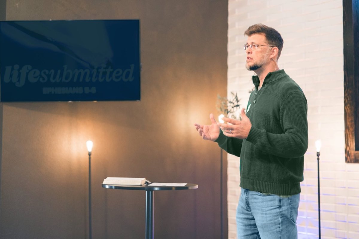Pastor Drew Caperton teaching from the Bible at Chisenhall Fellowship